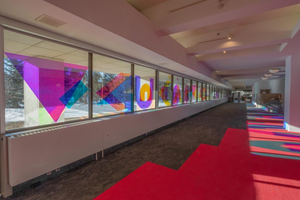 Window Installation by artist Joi T. Arcand in MacKenzie Lobby made of dichroic film