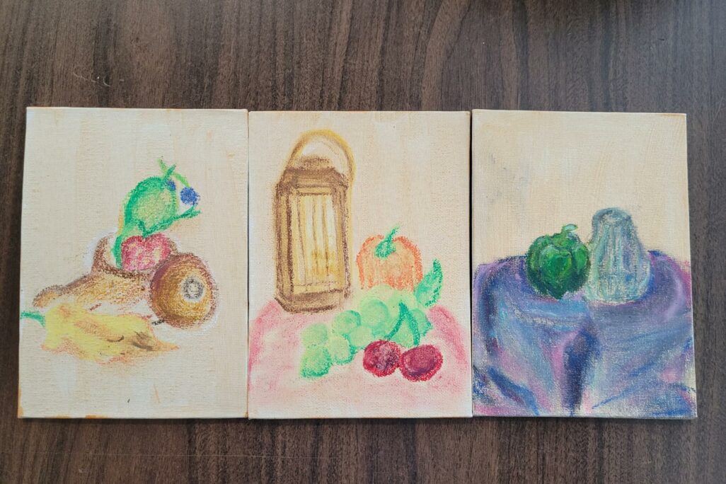 Oil pastel artwork examples of still life drawing featuring vegetables and fruit.